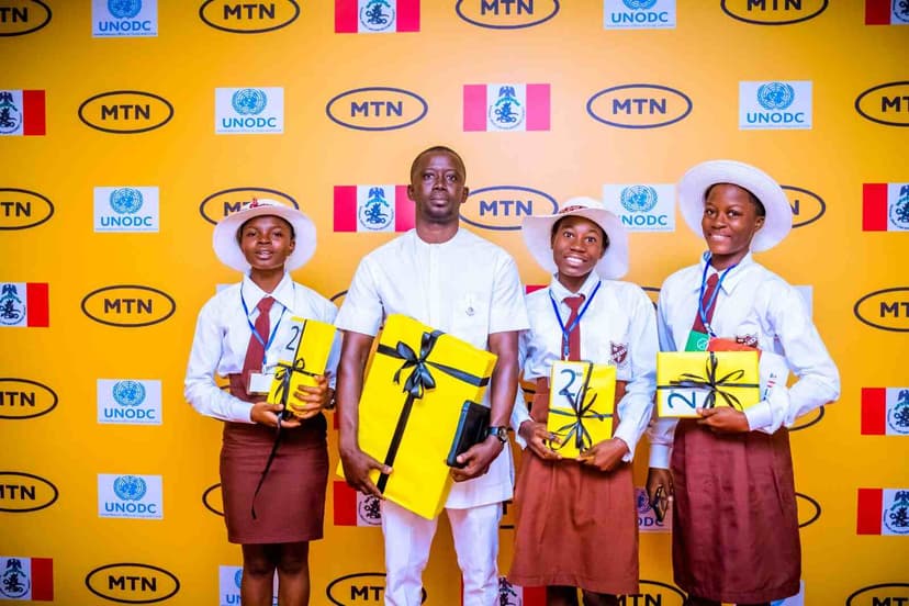 Students with yellow gift boxes at MTN event