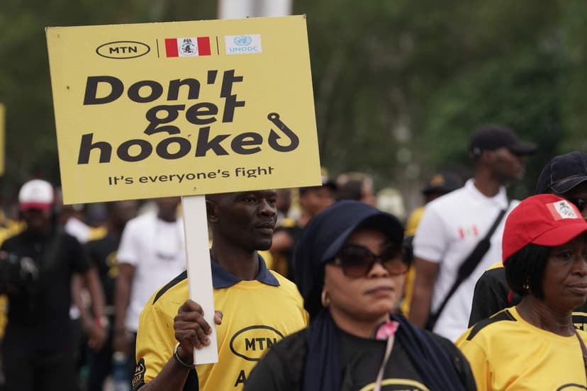 MTN ASAP rally with 'Don't get hooked' sign